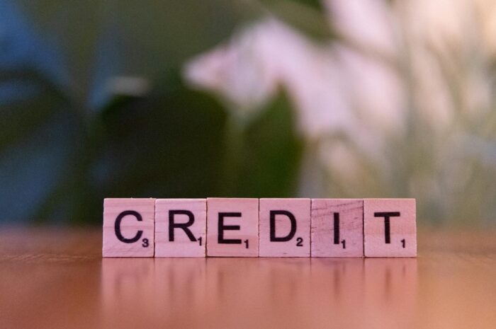 How To Improve Your Credit Score While In Debt